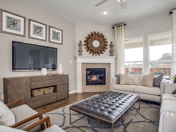 The gathering room features abundant natural light and optional fireplace