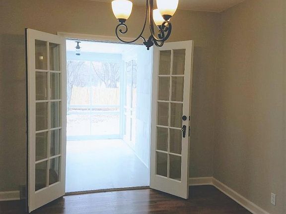 French doors open to screened in back porch