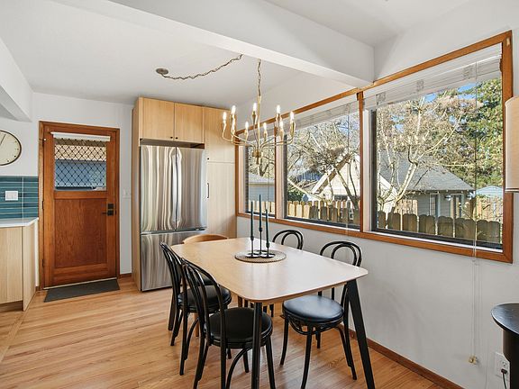 Dining area and rear entry, leading to parking area.