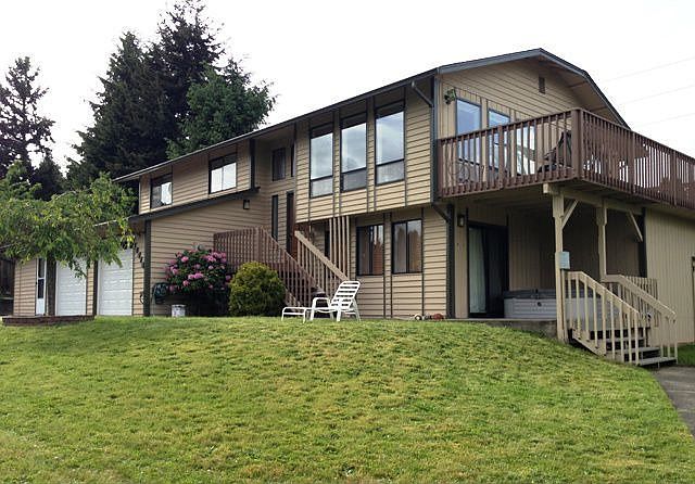 View of the front from driveway~large 4 bedrooms~2.5 baths~light, bright living area~large rec-room~vaulted ceilings~stainless kitchen~huge rec-room~2 car garage (easily converted to 3 car)3rd car garage currently used as an office with outside entrance