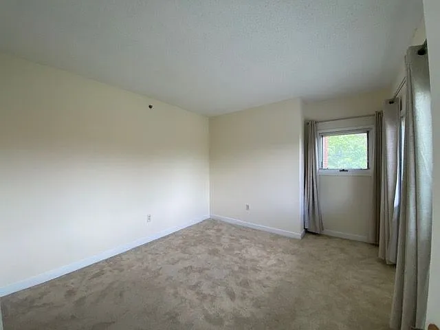 Another view of primary bedroom.