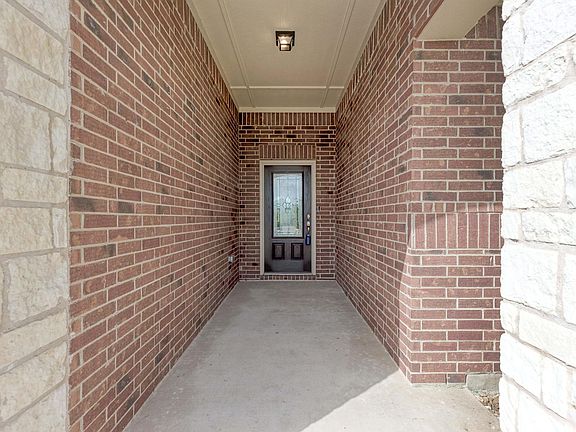 A large front porch welcomes you. It also provides cover from the rain and plenty of space to decorate for the holidays!