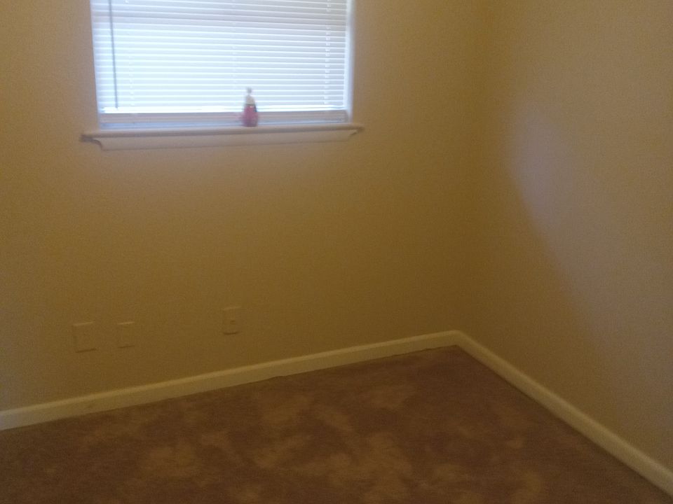 This is first bedroom entering the hallway towards the master bedrooms and the third bedroom,