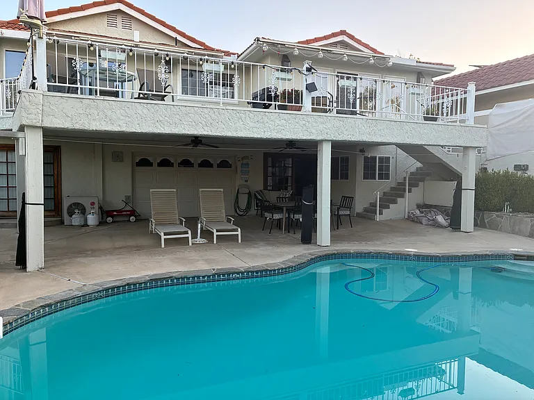 Living area is in right corner below main house. Upper deck access is not included.