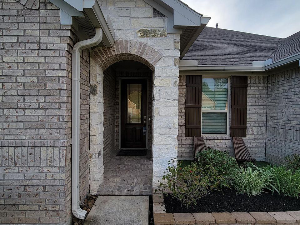 Front Entrance with cozy porch on the side.
