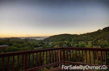 Front View
						:
						Apartment in foreground, main house attached. Additional garage unit below.