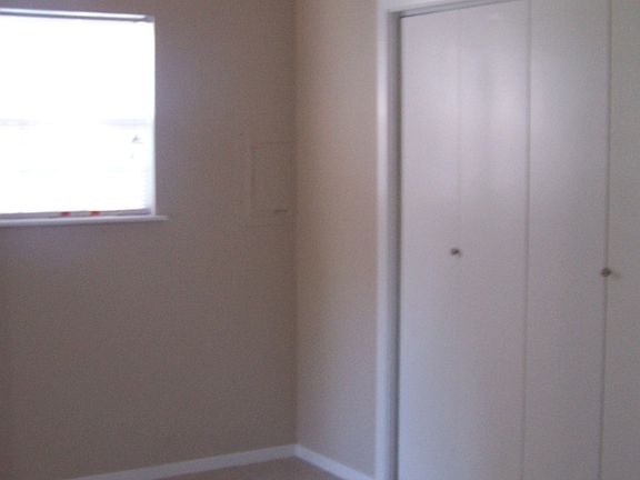 Kitchen/Dining area & view of laundry closet