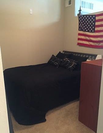 Bedroom off hallway with sliding door