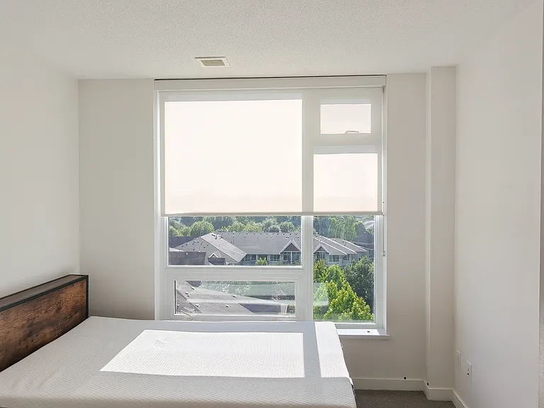 Primary bedroom with en-suite bath and large walk-in closet. Beautiful sunset views from west