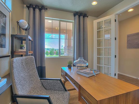 The den turns into an ideal home office when you add French doors, creating privacy while remaining