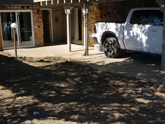 Carport and front entry.