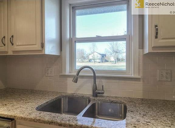 Very chic new sink with lots of lovely granite.