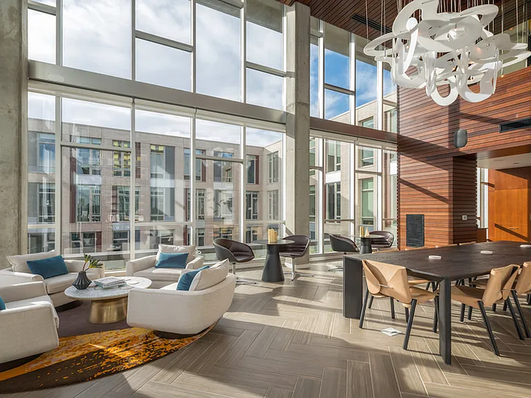 Expansive windows in an open area with social seating