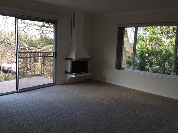 Enjoy the beautiful scenery from this apartment in the treetops. Aesthetic gas fireplace activates with flip of a switch