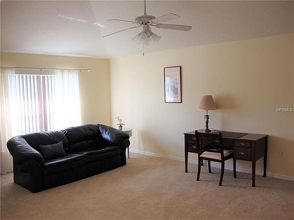 Living Room at the front of the house, with natural light coming through.