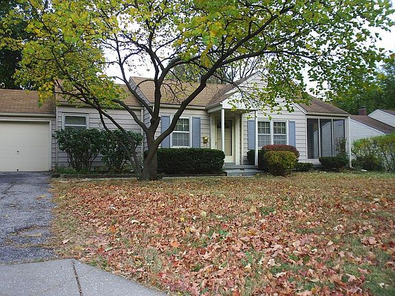 Front yard in fall. Screened in porch is to the right.