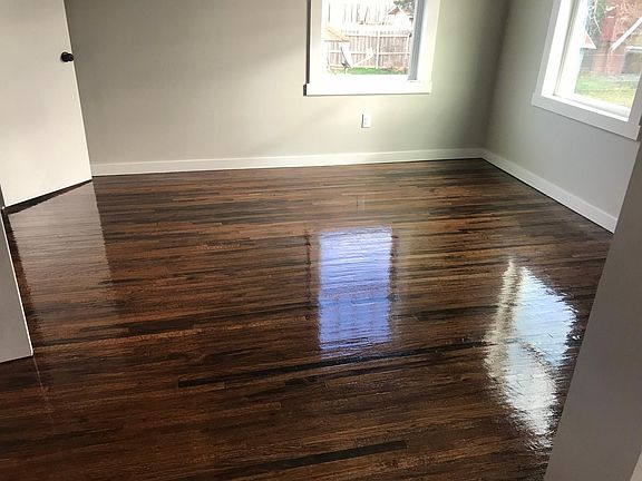 Bedroom backyard view when the hand-scraped hardwood floors were just refinished. They are matte now, not that shiny.