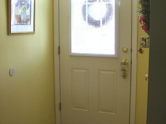 Welcoming Foyer with Laminate Flooring