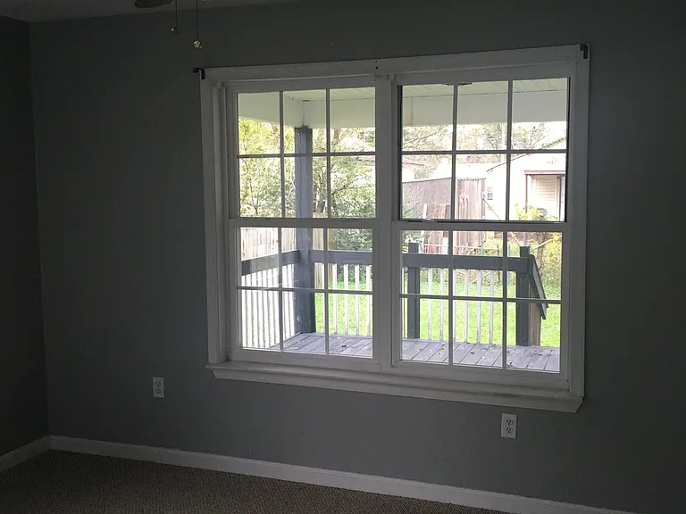 Bedroom overlooking the rear deck and backyard.
