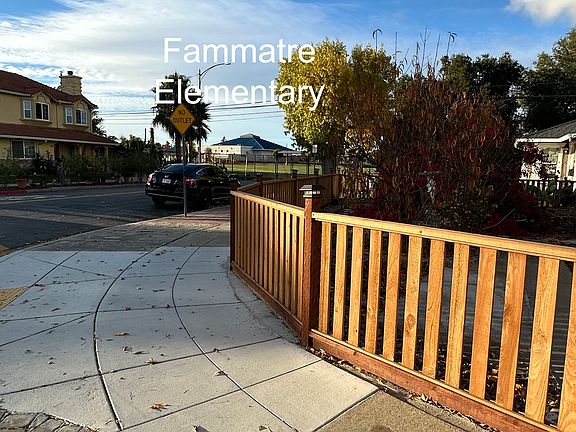 VIEW OF CORNER WITH PATHWAY TO SCHOOL