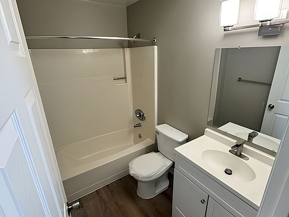 Modern bathroom with a sleek vanity, elegant lighting, and a spacious bathtub offering comfort and style. Modern bathroom with a sleek vanity, elegant lighting, and a spacious bathtub offering comfort and style.