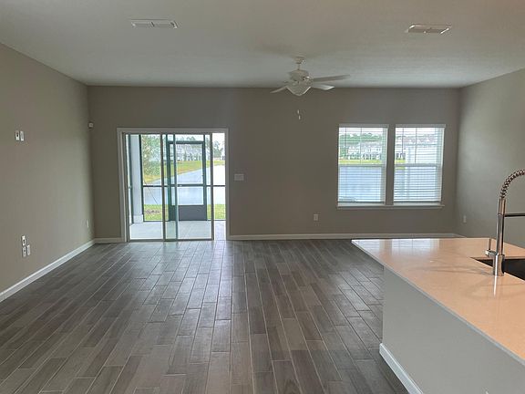 Spacious living area to screened porch & lakeview