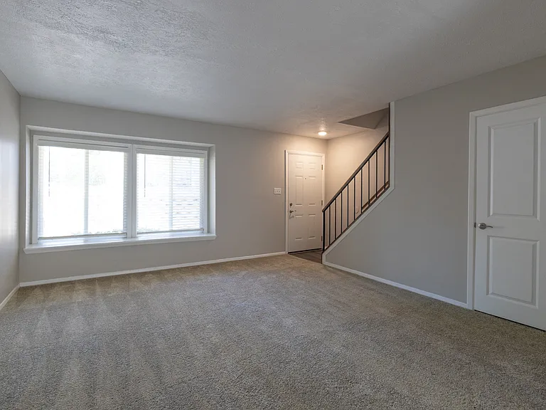 Living Room in the Two Bedroom Townhome at Woodbridge Bloomington