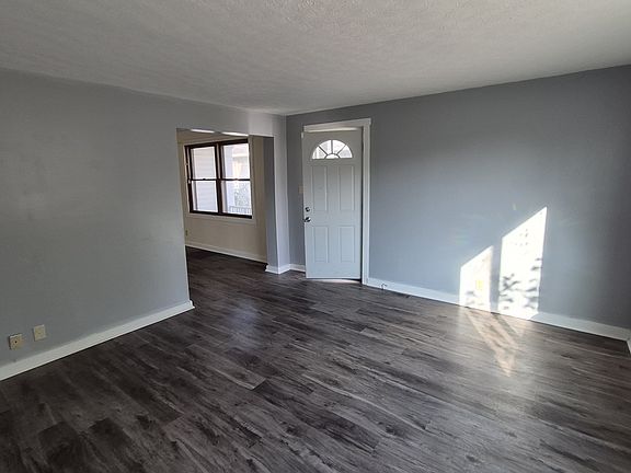 living room and entry door from patio