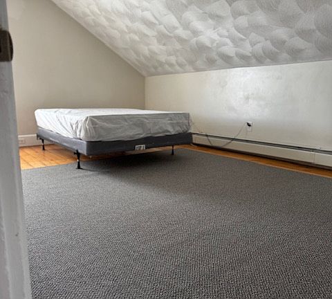Large bedroom with new boxspring and mattress