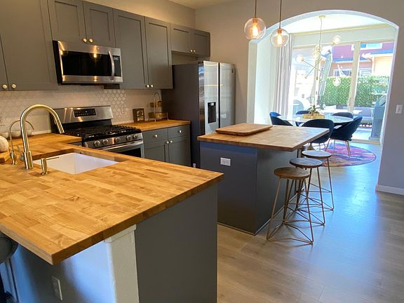 Updated kitchen cabinets, backsplash, lights, countertops, sink and all new appliances.