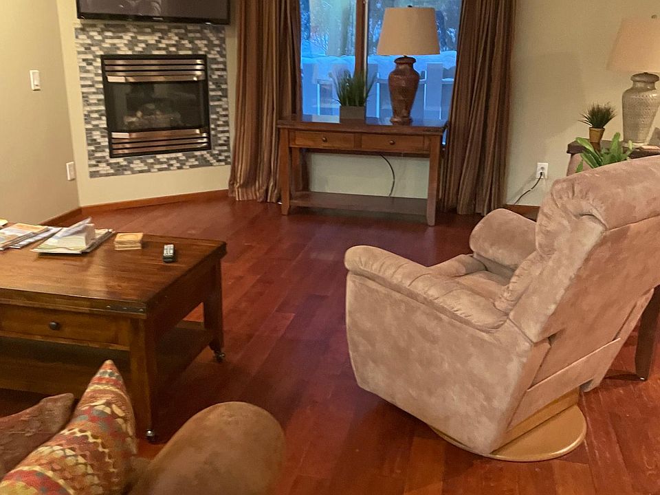 Living room looking outside and to fireplace.