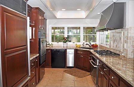 Kitchen with newer appliances, granite & cherry wood