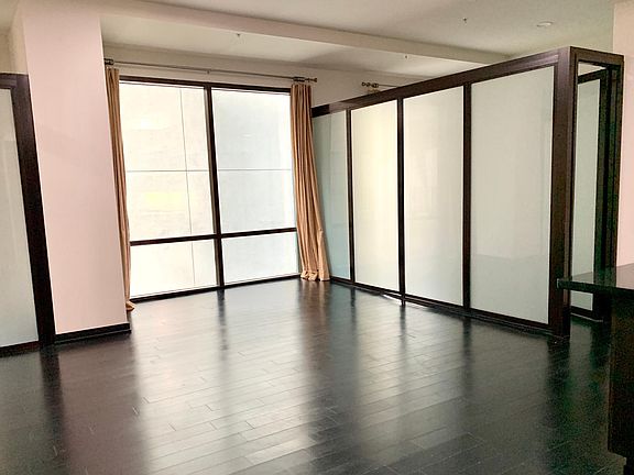 Living room. Open loft design, bedroom areas are partitioned with glass by the Slidingdoor Company