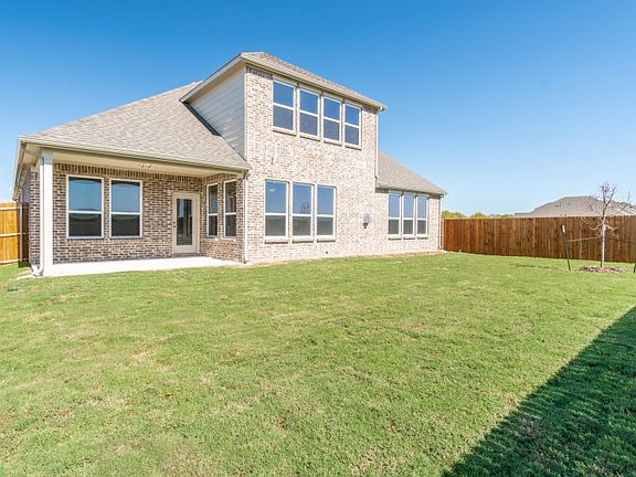 New Construction Spacious, fenced-in backyard with covered patio.