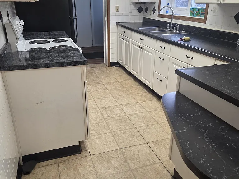 Spacious Kitchen with Ample Cabinet & Counter Space