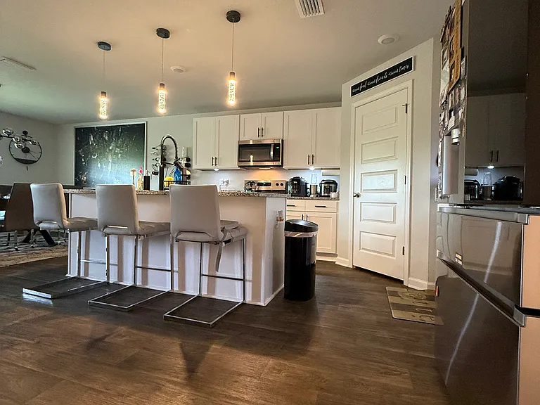 Kitchen with 3 Pendant lights.