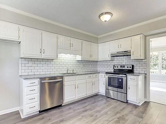 Granite counter-tops in kitchen and bathrooms. We supply the refrigertor (not shown) or bring your own...We supply the washer dryer too...or bring your own.