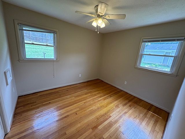 front bedroom with east and west facing windows with Fan/light