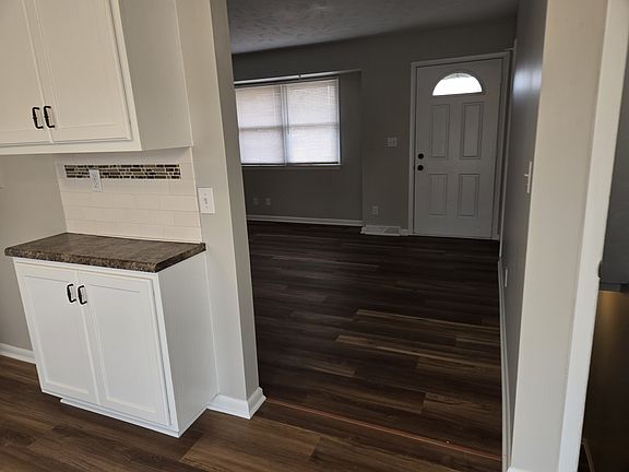 In kitchen looking into the living room