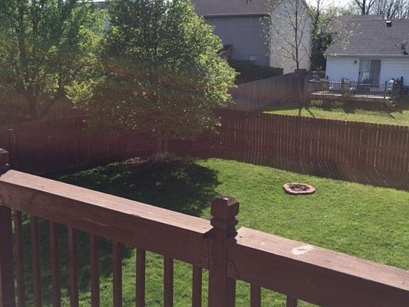 Fenced in backyard w/firepit and garden area