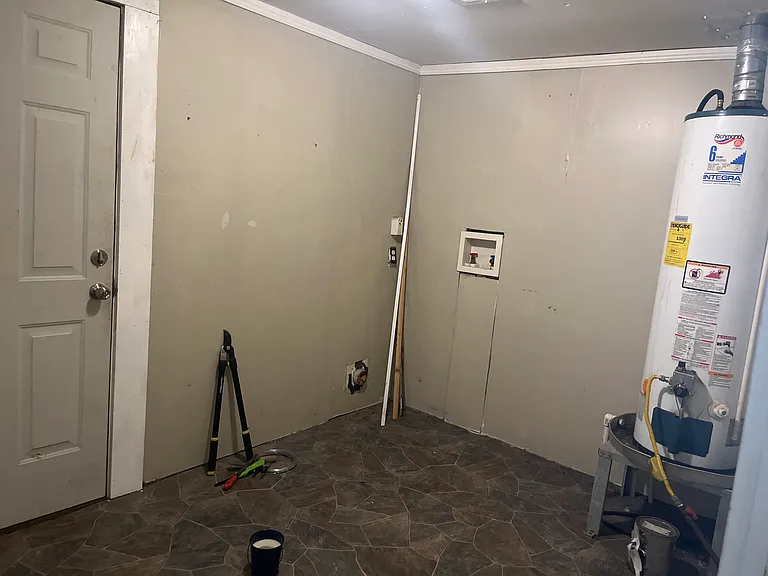 Laundry room/pantry with access to fenced back yard.