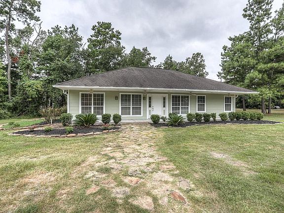 Relax on the covered front porch of this quaint cottage.