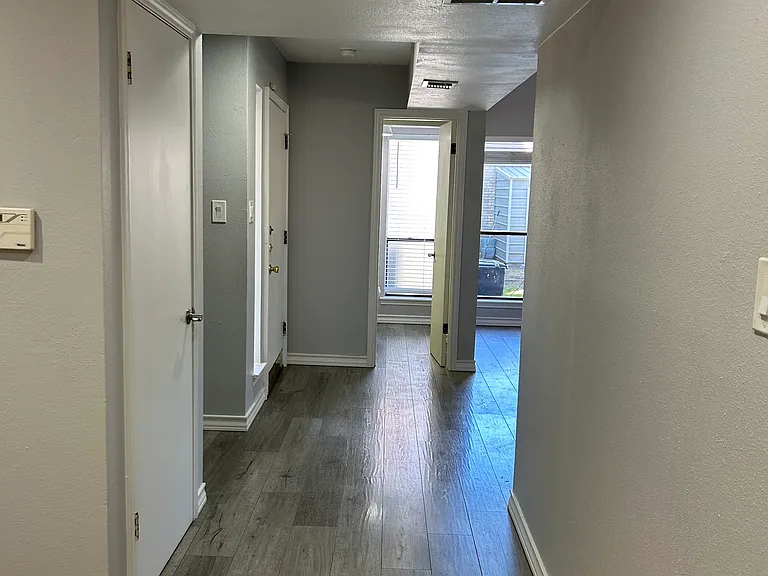 Okay time to leave the breakfast room and head down the short hall and to our left is a large storage area under the staircase. Far side is the powder room.