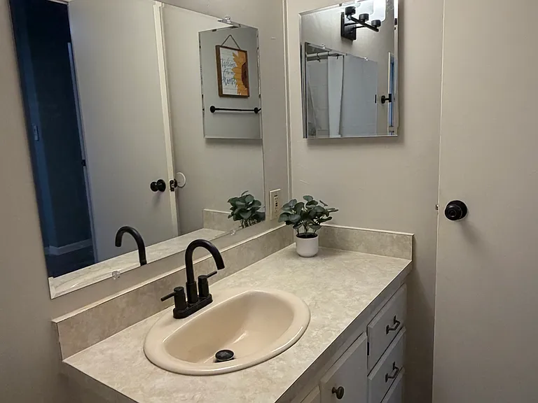 master bath with large linen closet and walk in shower