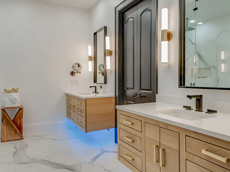 primary bath with floating vanities