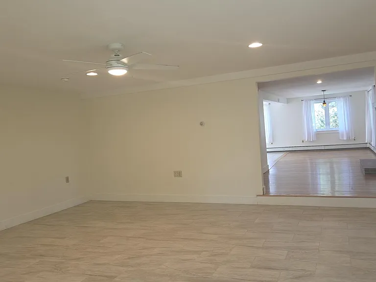 Large Living Room With New Tiled Flooring. Living Room Has Radiant Floor Heat!