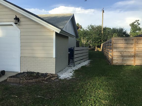 Side yard, pool equipment/ garbage cans
