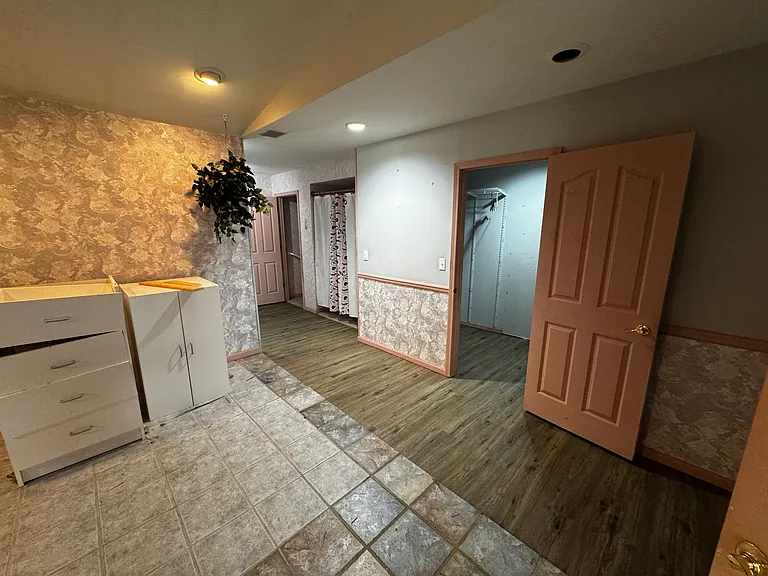 Full bathroom with big walk in closet