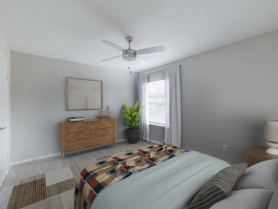 Bedroom with plush carpeting
