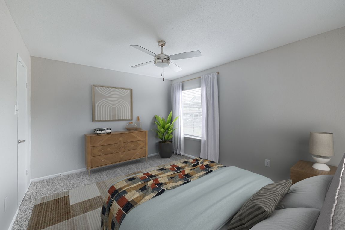 Bedroom with plush carpeting